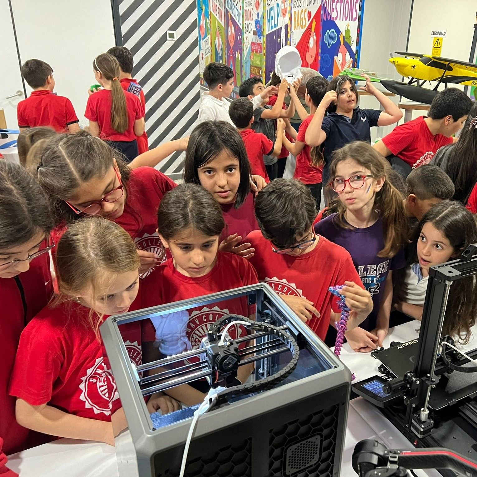 Children around 3D printer without protection